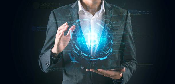 Black and white portrait businessman in suit holding futuristic digital light globe, abstract finance investment digital currency, crypto currency, and digital technology idea.