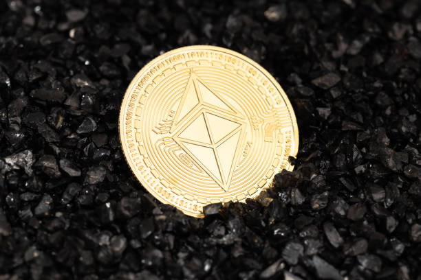 Galicia, Spain; october 25, 2021 : Ethereum classic coin on black gravel background. Cryptocurrency blockchain money