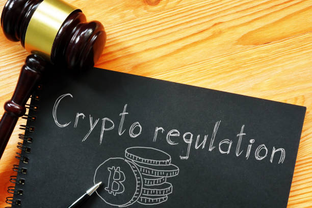 Crypto regulation is shown on a business photo using the text