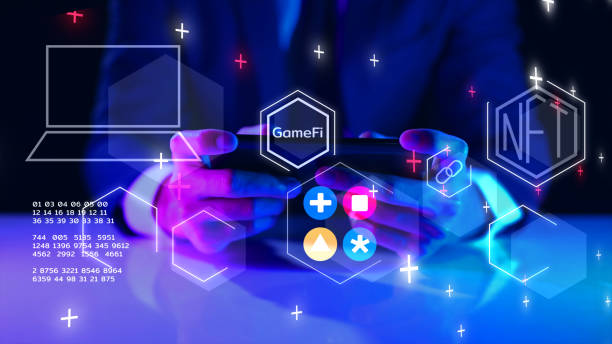 GameFi DeFi futuristic NFT GameFi decentralized finance play to earn game, online digital technology. Businessman with mobile phone graphic icon modern game business investment idea